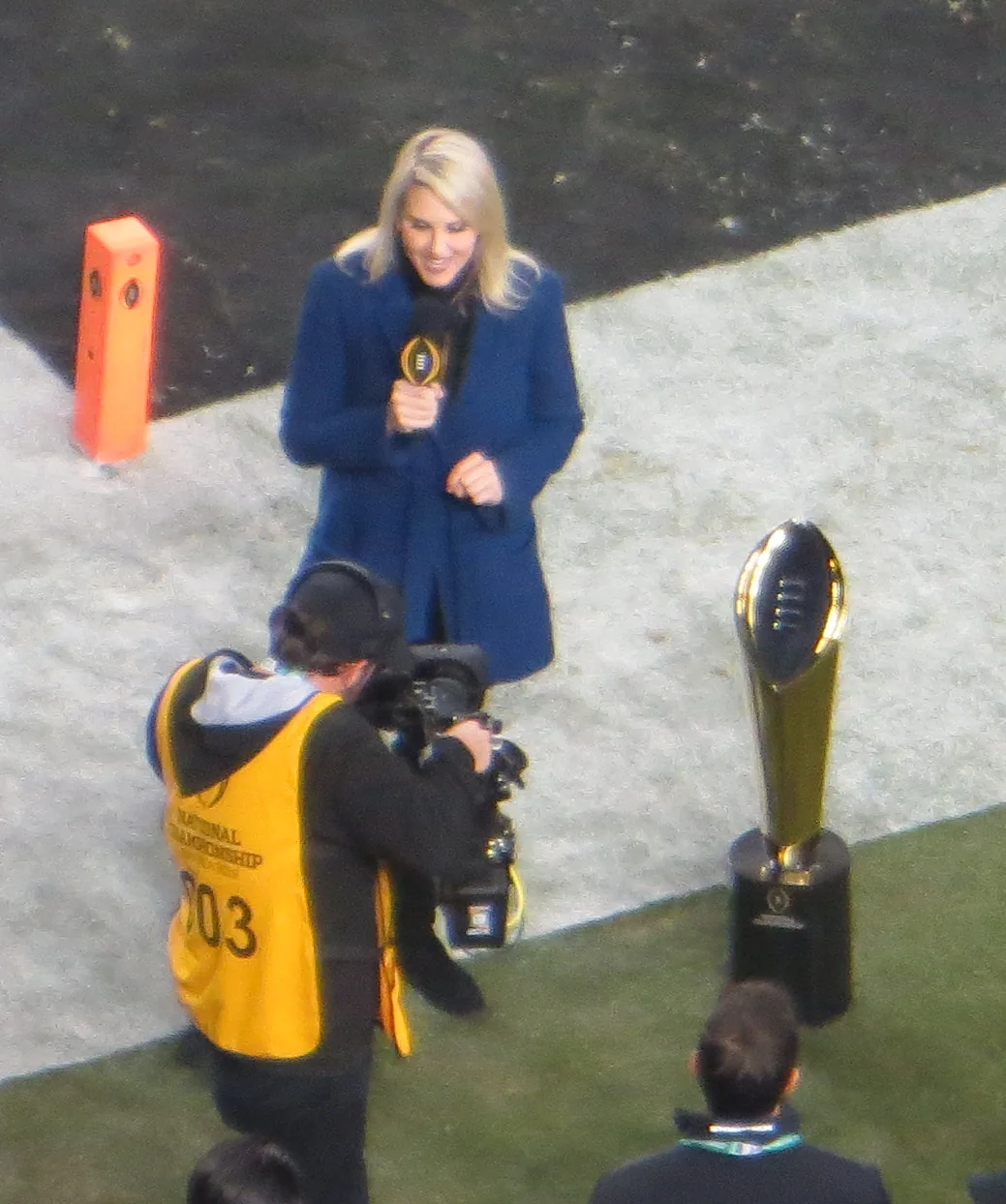 College Football Playoff National Championship Trophy beside the field in 2019