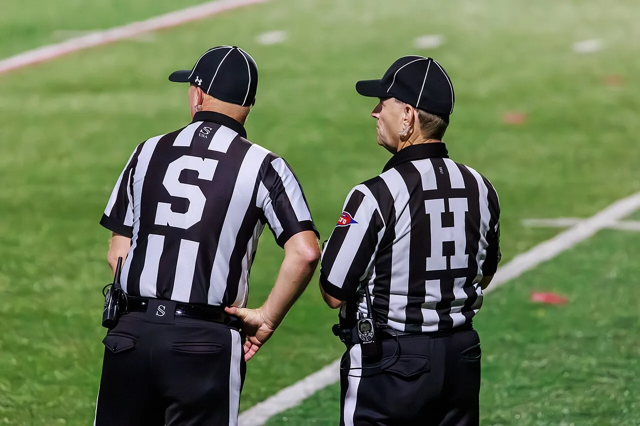 Side judge and head linesman at a Merrimack football game
