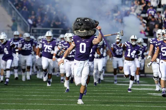 Kansas State Wildcats mascot leading the team onto the field