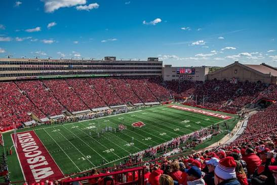 Camp Randall Stadium in Madison packed with thousands of supporters in red creating a sea of color on game day